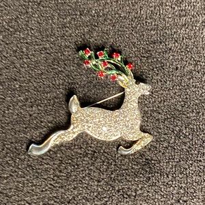 Reindeer pin with red and green antlers